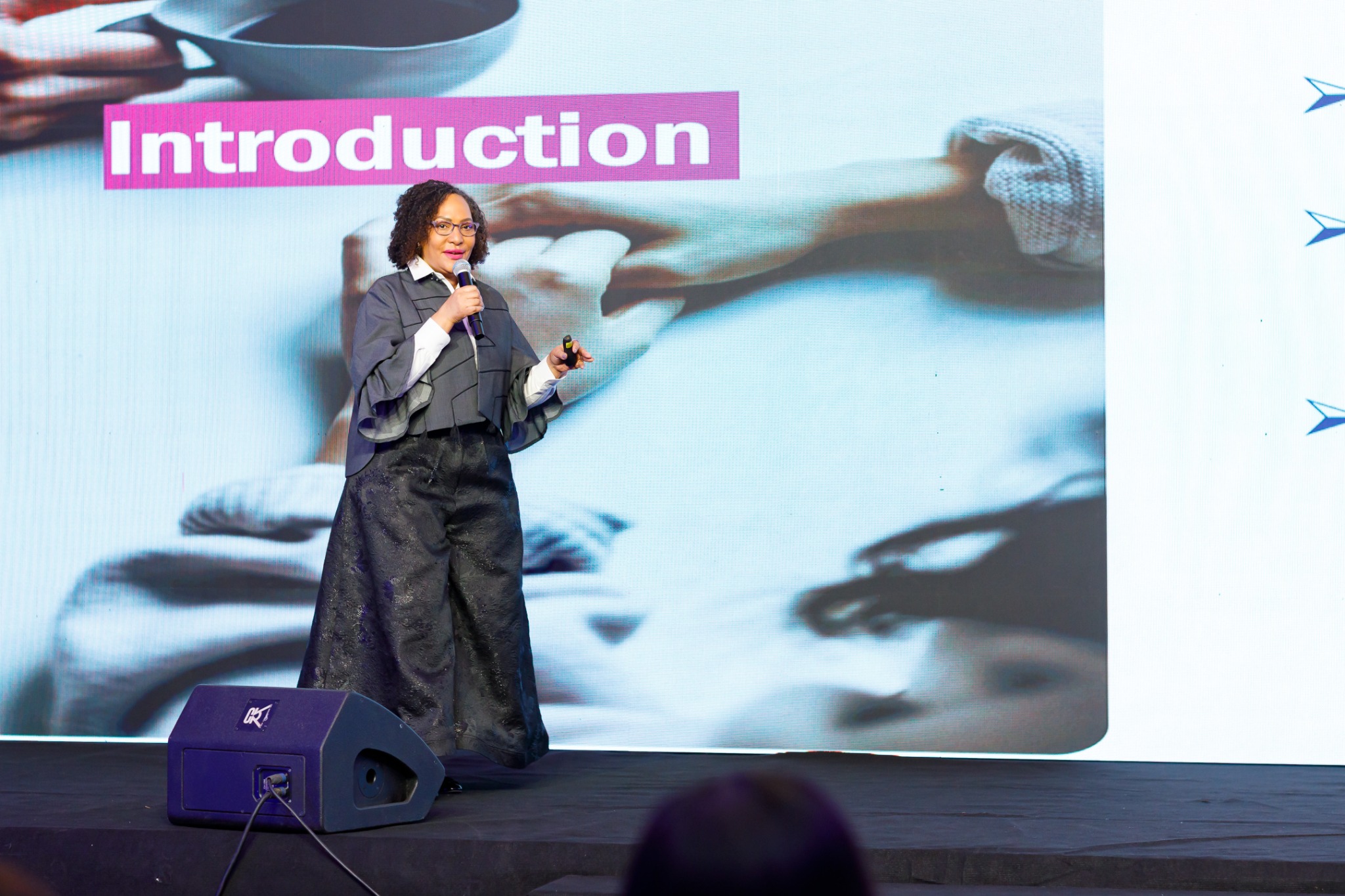 Catherine facilitating a session on stage